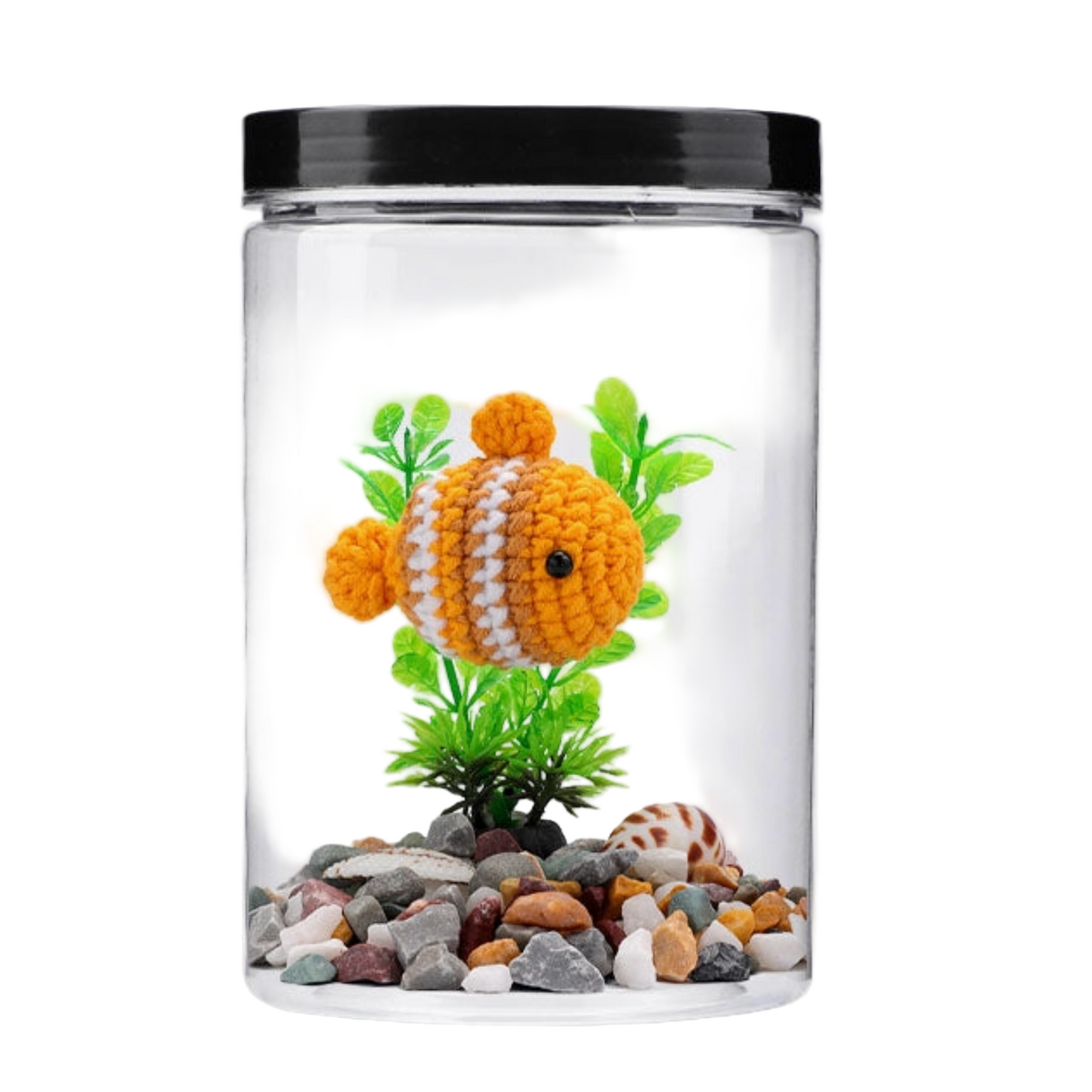 Small aquarium with a knitted goldfish, plants, and pebbles on a white background