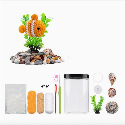 Crocheted fish toy with aquarium accessories and 'The Loop Brigade' branding.