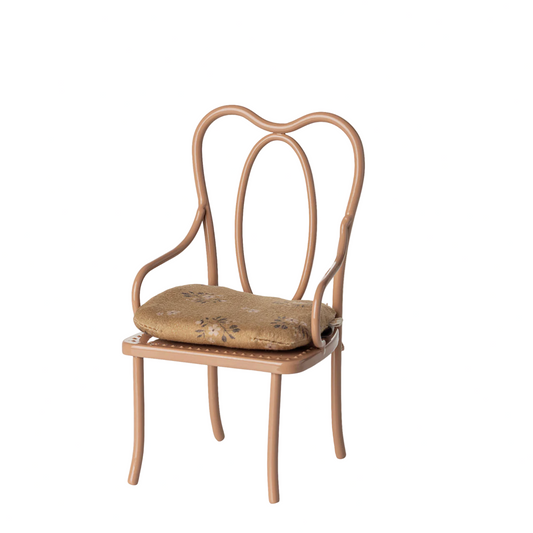 Vintage-style chair on a website with a beige background