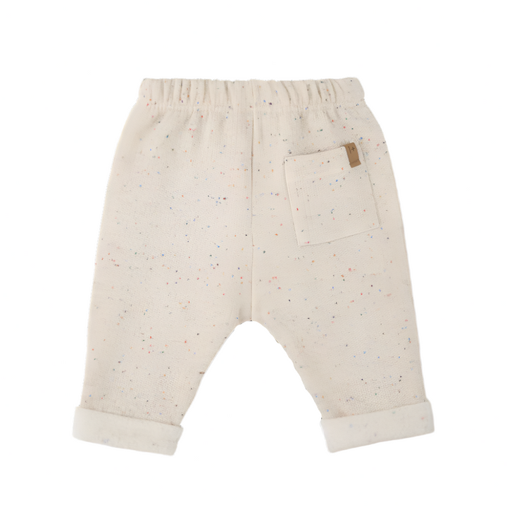 Beige baby shorts with a small patch on a white background
