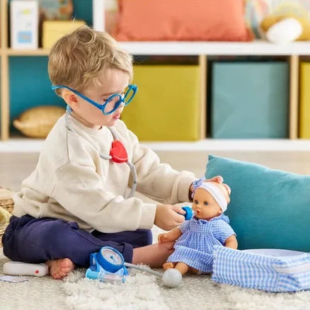 Child playing with a doll in a colorful room